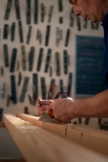 male-wood-worker-his-shop-working-with-tools-equipment Compelling Reasons to Choose Skyview Flooring